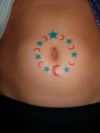 star tattoo on round of navel